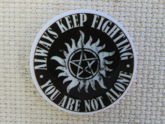 First view of Always Keep Fighting Needle Minder.