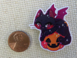 Second view of Dragon Cat Sitting on a Carved Pumpkin Needle Minder.