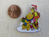 Second view of Pooh, Tigger and Piglet opening a Christmas gift minder.