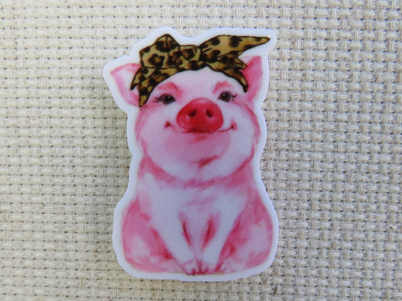 First view of a bandana wearing pig minder.