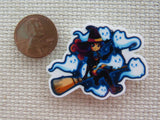 Second view of Witch riding a broomstick with kitty ghosts flying around her minder.