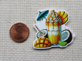 Second view of Blue Umbrella Tropical Drink Needle Minder with sliced mangos, coconuts and drizzled in yummy goo.
