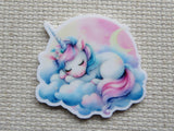 First view of Snoozing unicorn on a pillow of clouds with a pink sky and crescent moon minder.
