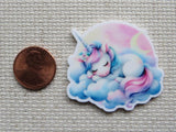 Second view of Snoozing unicorn on a pillow of clouds with a pink sky and crescent moon minder.