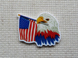 First view of a patriotic bald eagle holding an American flag minder.