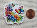 Second view of  rainbow colored butterfly with a cascade of rainbow colored flowers minder.
