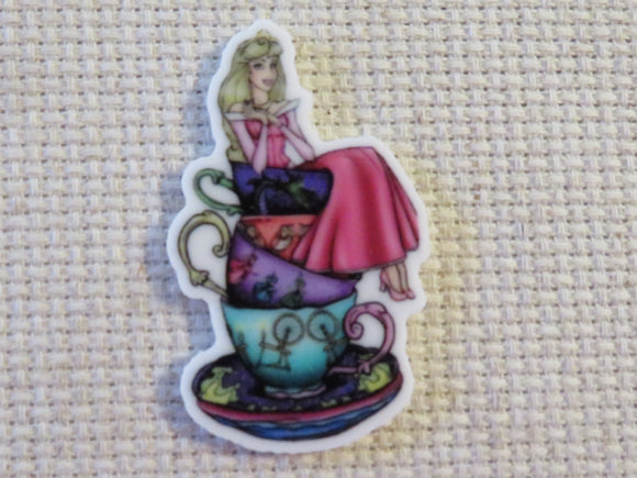 First view of Aurora o.n a Stack of Teacups Needle Minder