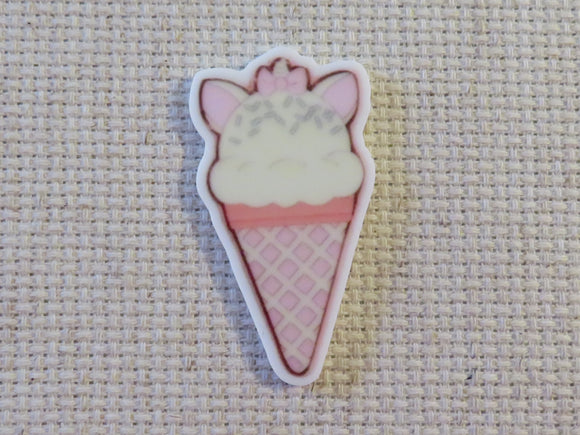 First view of Ice cream cone in the shape of a white cat with pink ears and a bow minder.