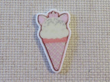 First view of Ice cream cone in the shape of a white cat with pink ears and a bow minder.