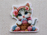 First view of a cute cat with balls of yarn minder.