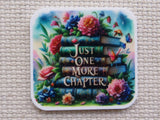 Minder with books and flowers design reading 'Just One More Chapter'.