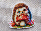 First view of Cute hedgehog with a red and white polka dotted mushrooms minder.