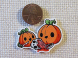 Second view of Carved Pumpkins Carving a Skull Needle Minder.