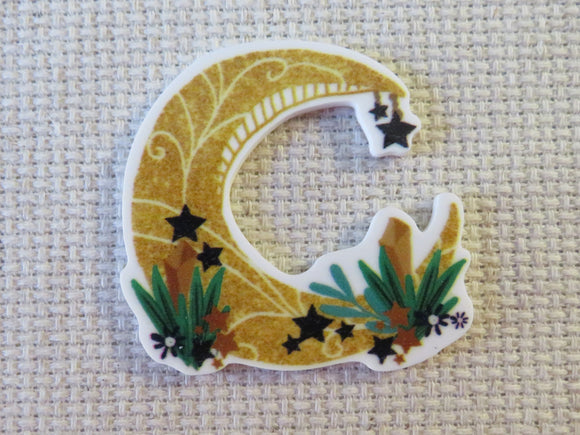 First view of Yellow Crescent Moon Needle Minder.