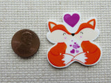 Second view of Kissing Foxes Needle Minder.