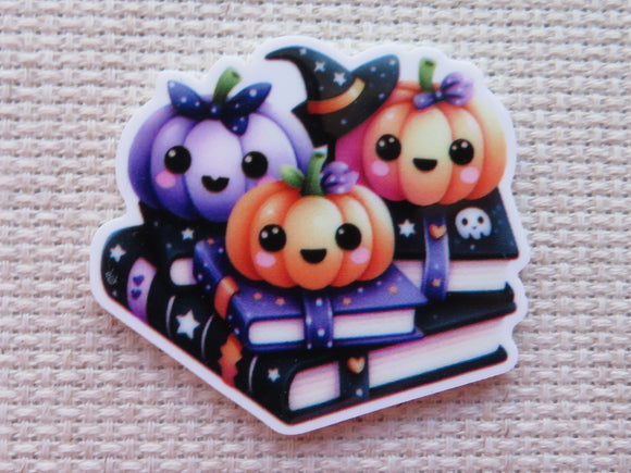 Cute Halloween-themed minder with pumpkins and a witch hat on a textured background