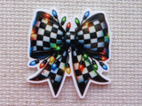 Checkered bow minder with Christmas lights on a textured surface