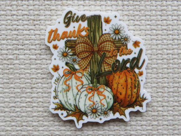 Decorative minder with pumpkins, cross, and text 'Give thanks to the Lord' 