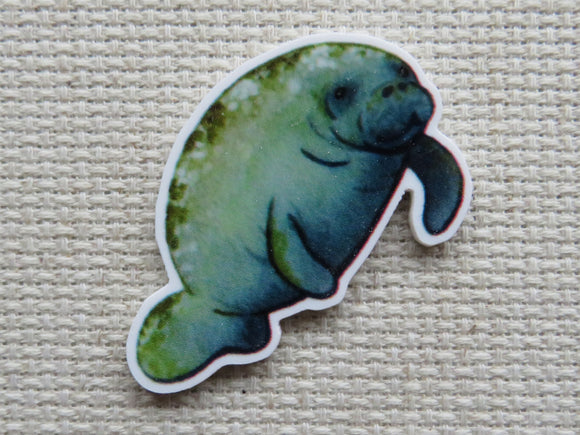 Minder of a manatee on a textured fabric background