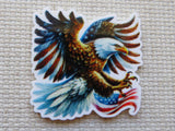 Minder of an eagle with an American flag design on a textured surface