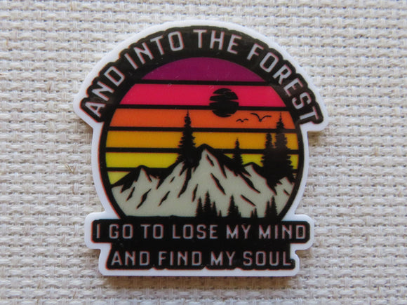 Minder with mountain and sunset design on a textured background