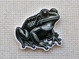 First view of a Black and White Frog  minder.