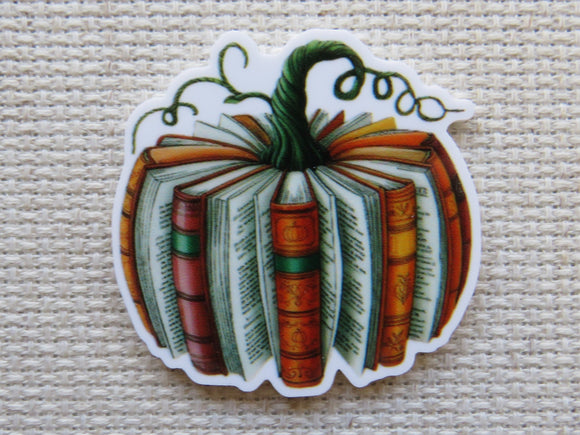 Pumpkin-shaped book minder with books inside on a textured beige background