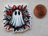 Second view of a ghost minder with a red bow.