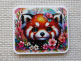 Minder with a red panda design surrounded by flowers on a textured surface
