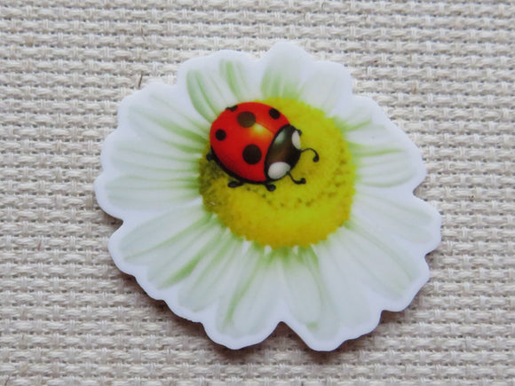 First view of Lady Bug on a White Daisy Needle Minder.