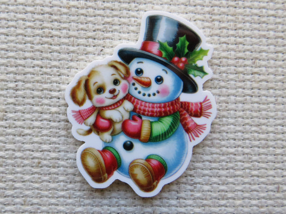 Minder of a snowman with a dog on a textured beige background
