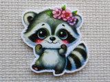 Minder of a cartoon raccoon with flowers on a textured surface
