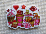 Minder with various Valentine's Day-themed items on a textured surface