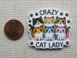 Second view of a minder with Six different colored cats with black paw prints and the words "CRAZY CAT LADY".