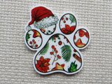 Decorative paw print minder with Christmas-themed design on a textured fabric background