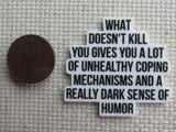 Second view of What Doesn't Kill You Gives You A Lot of Unhealthy Coping Mechanisms and A Really Dark Sense of Humor Needle Minder.