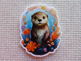 Minder of an otter surrounded by flowers on a textured surface