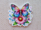 Colorful butterfly and flower minder on a textured fabric background