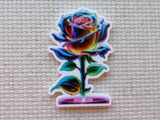 Colorful rose-shaped minder on a textured beige background