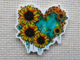 Heart-shaped minder with sunflower design on a textured background