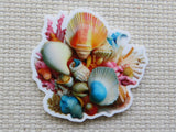 Colorful seashell design minder on a textured surface