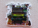 Minder with Halloween-themed books and decorations on a textured background