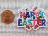 Second view of Minder with the words "HAPPY EASTER" in a variety of colors with bunny ears over the top and bunny feet sticking out the bottom. 