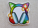 Colorful minder of headphones with cat ears on a textured surface