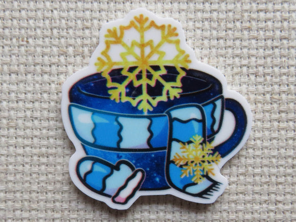 First view of Scarf and Mitten Teacup Needle Minder.