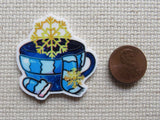 Second view of Scarf and Mitten Teacup Needle Minder.