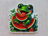 Minder of a frog holding a watermelon on a textured beige background