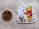 Second view of Pooh is Picking a Basket of Flowers Needle Minder.