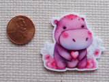 Second view of a pink hippo minder.