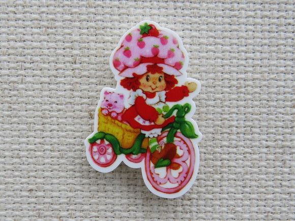 First view of Strawberry Shortcake Riding a Bike Needle Minder.
